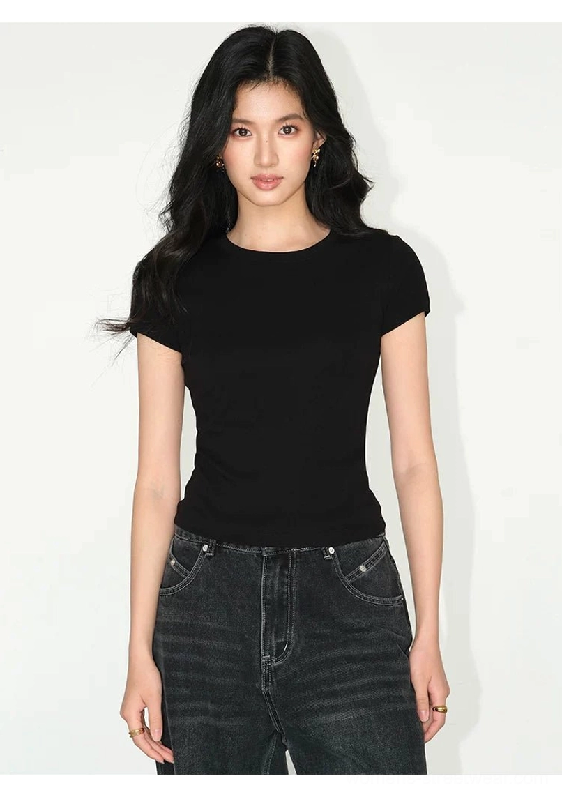 solid black fitted crew neck tee short sleeve full body front view with dark jeans classic minimal look