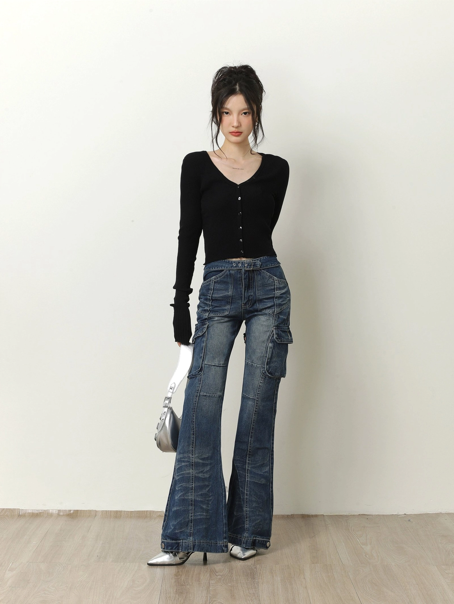 Black fitted cropped ribbed knit cardigan with button front styled with vintage blue cargo jeans and silver heels