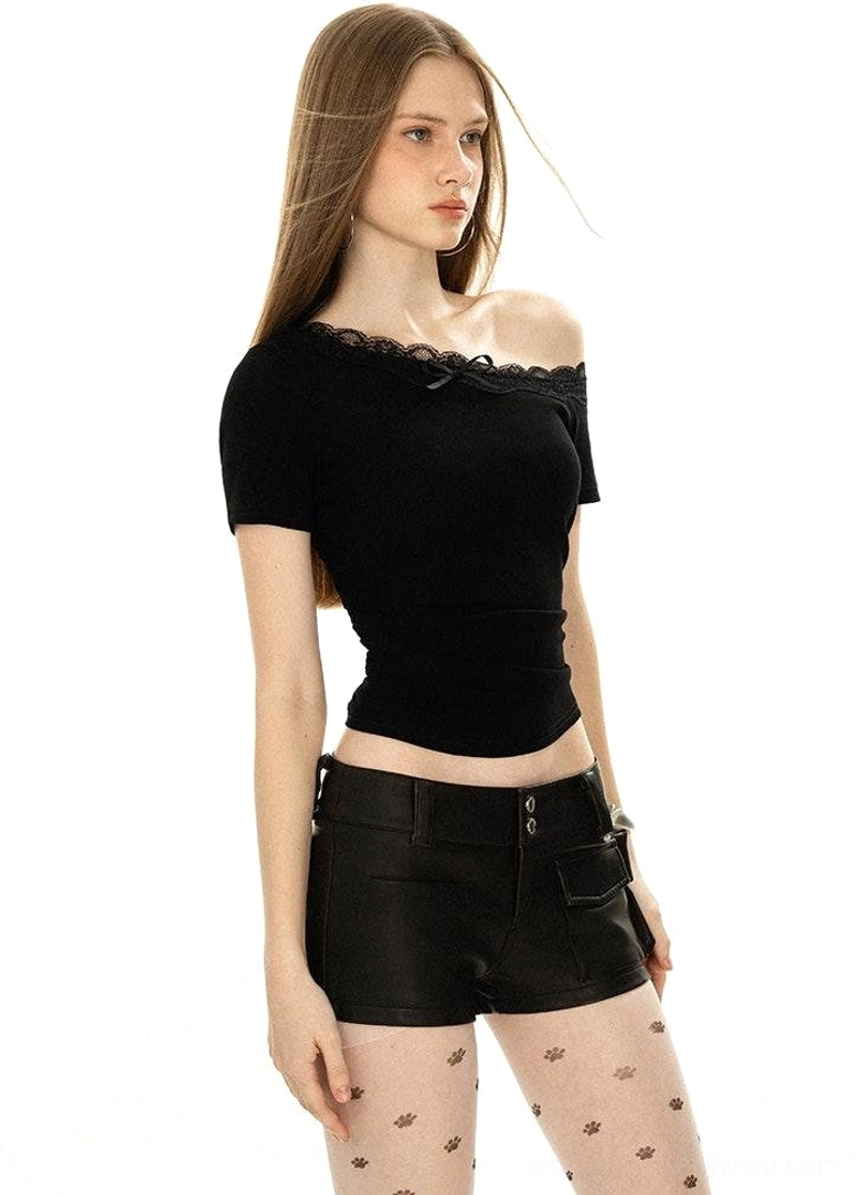 Side view of black fitted off-shoulder lace trim streetwear top with short sleeves and bow detail
