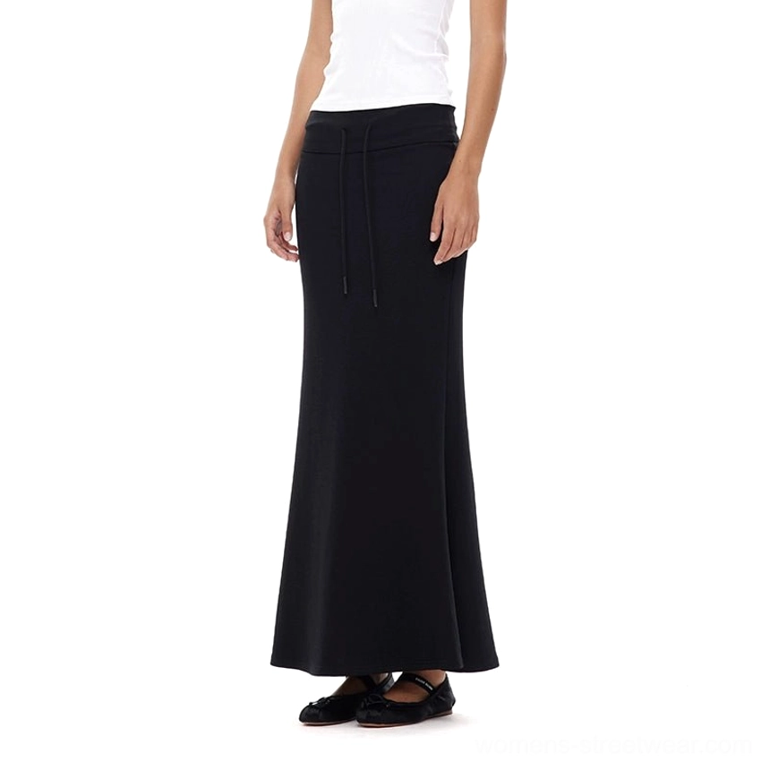 Black fitted stretch mermaid maxi skirt close-up showing the drawstring waist, smooth fabric, and flowing fishtail hem