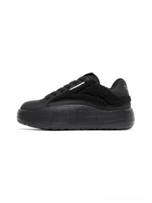 Black fleece-panel platform sneakers with plush shearling texture, matte toe caps, tonal laces, and embossed thick streetwear soles