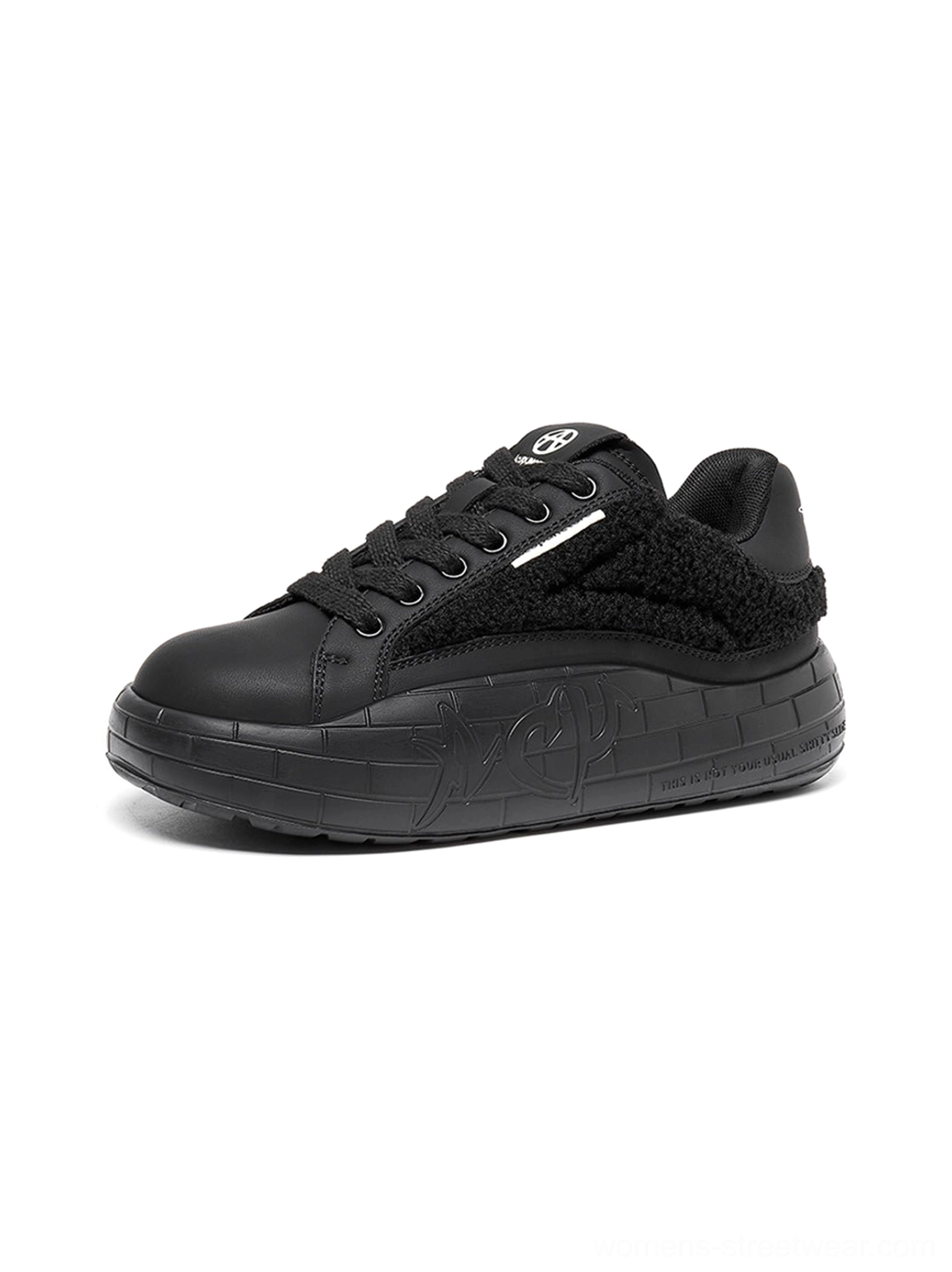 Black fleece-panel platform sneakers with tonal lace-up design and chunky embossed streetwear outsole