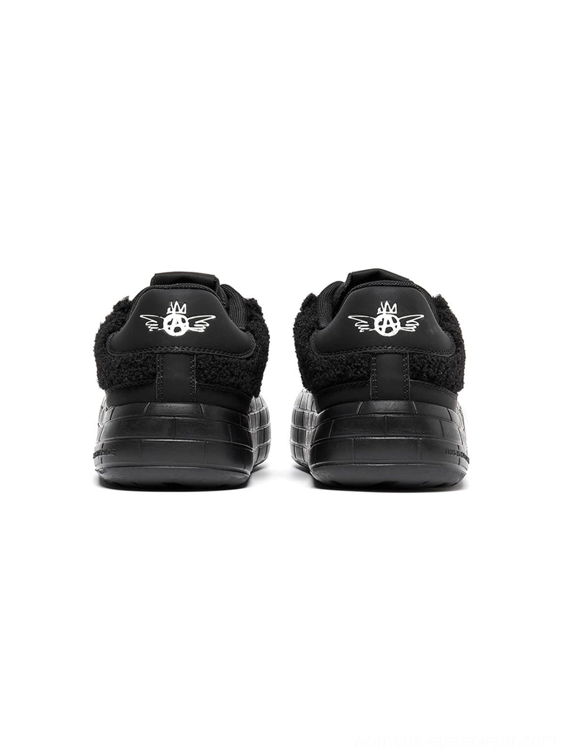 Black fleece-panel platform sneakers for women's streetwear outfits with plush texture and sculpted thick soles