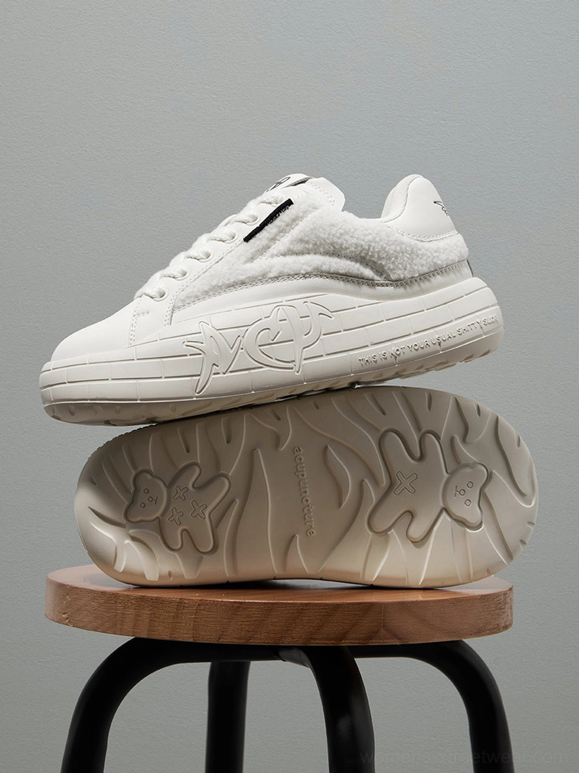 Black fleece-panel streetwear shoes with elevated platform profile and versatile monochrome styling