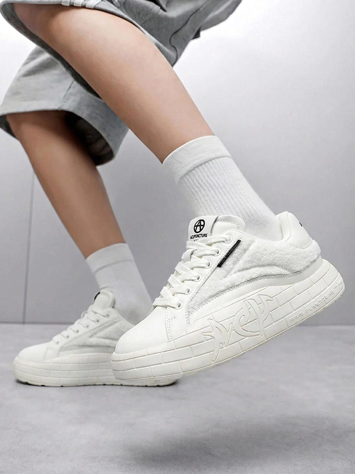 Black fleece platform shoes with cozy winterized texture and contemporary women's casual streetwear shape