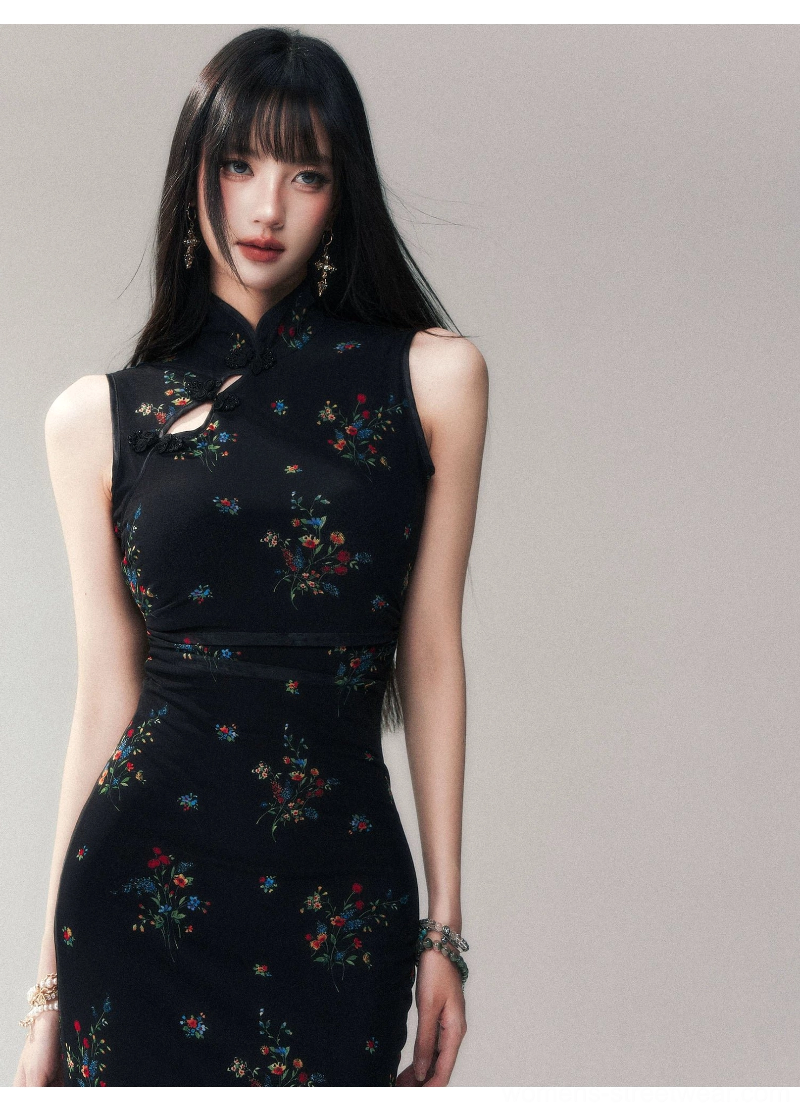 Front full body view of a black floral bodycon cheongsam dress with Mandarin collar, keyhole neckline, sleeveless cut, and multicolor flower print