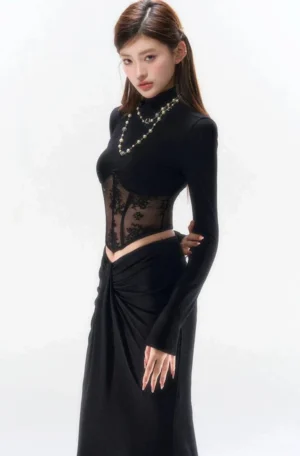 Three-quarter view of black floral lace corset evening outfit with high-neck long-sleeve top and high-waisted draped maxi skirt