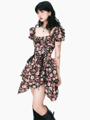 Side view of a floral puff-sleeve mini dress with ruched bust, fitted waist, ruffled uneven hem, and black knee-high boots