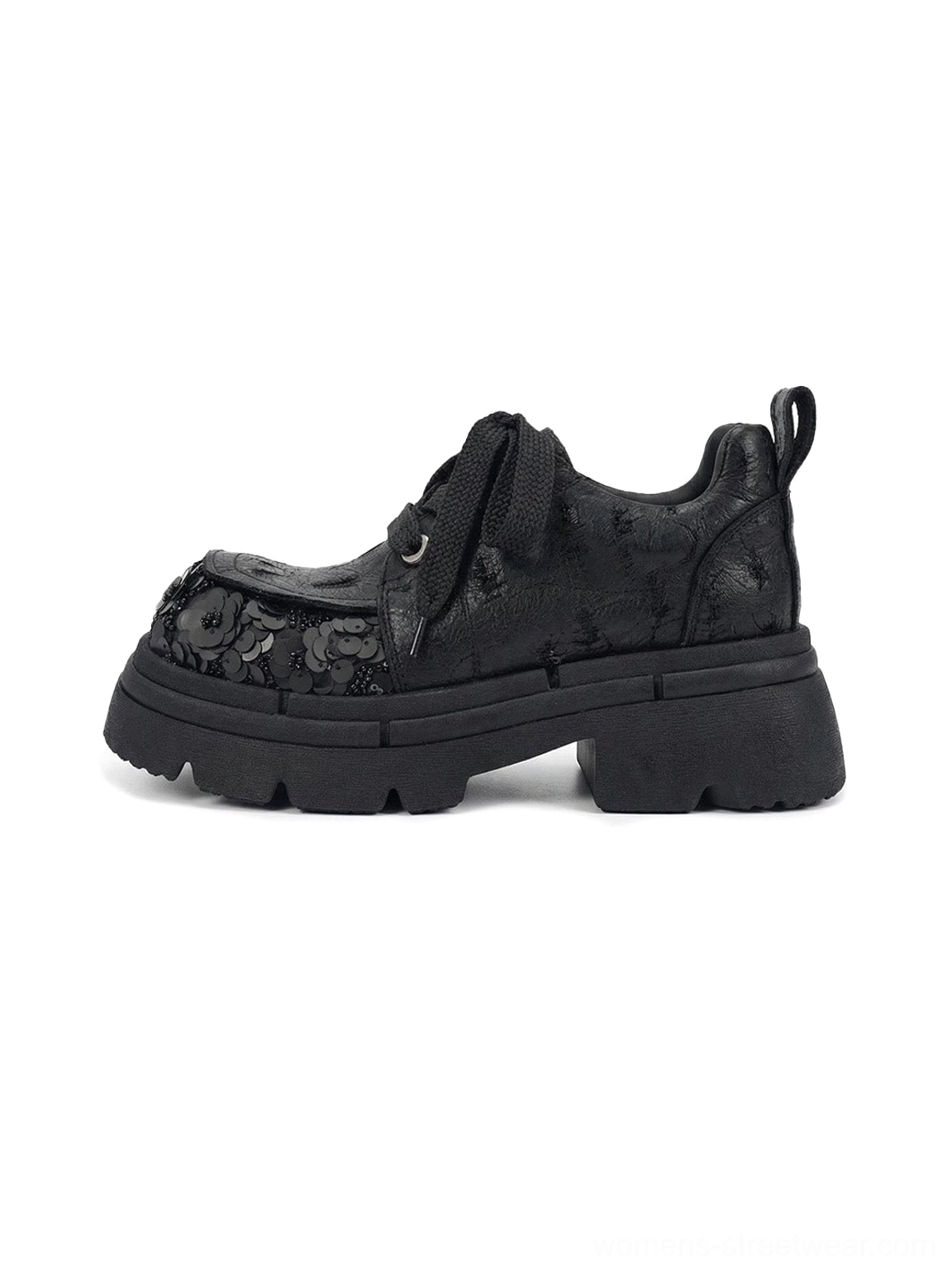 Black floral sequin platform derby shoe in side three-quarter view with 3D flower toe cap, rope laces, rounded square toe, rear pull tab, and chunky EVA platform sole