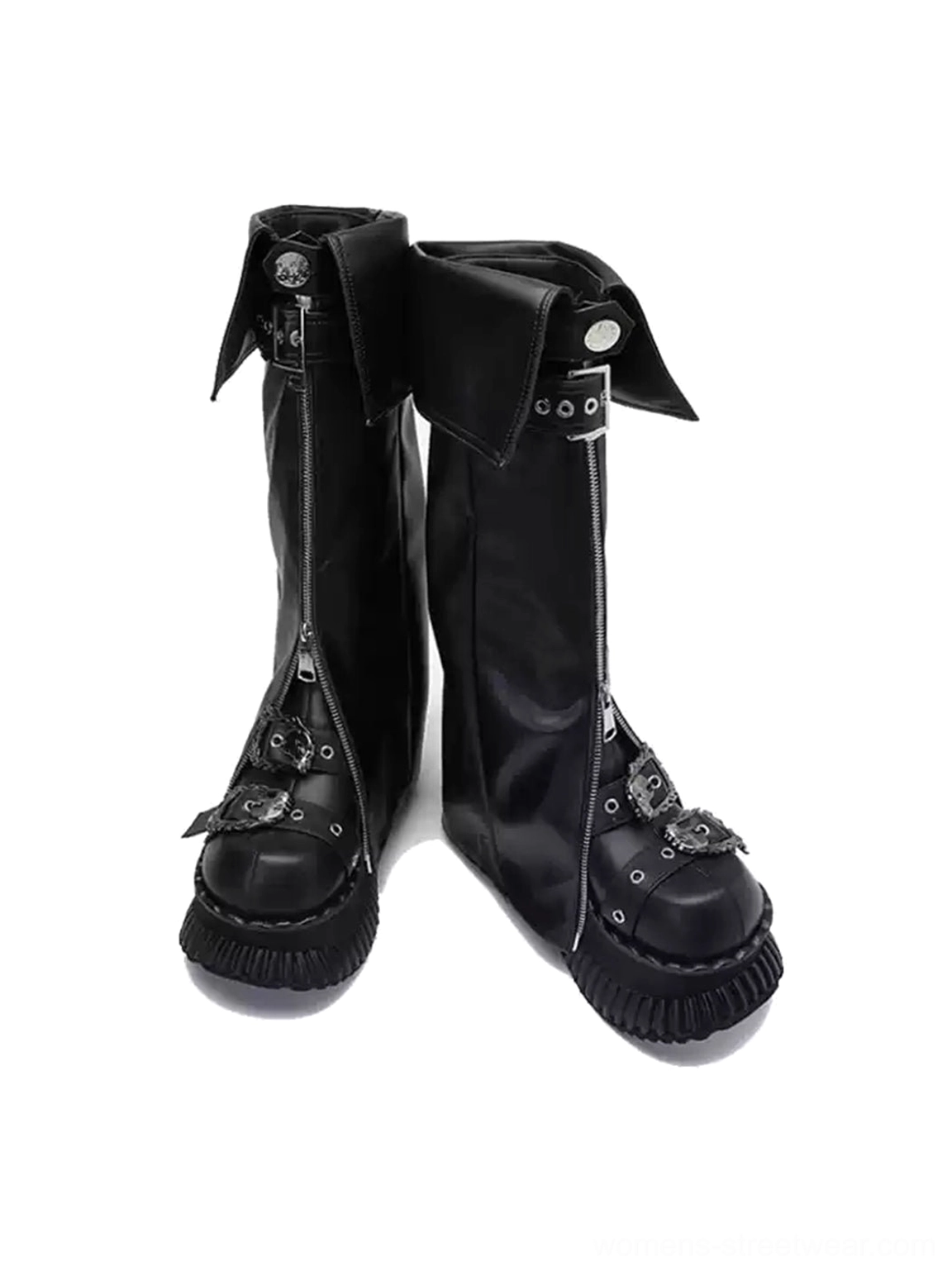 Front angled view of black foldover buckle platform knee-high boots with metal toe detail and ridged platform outsole