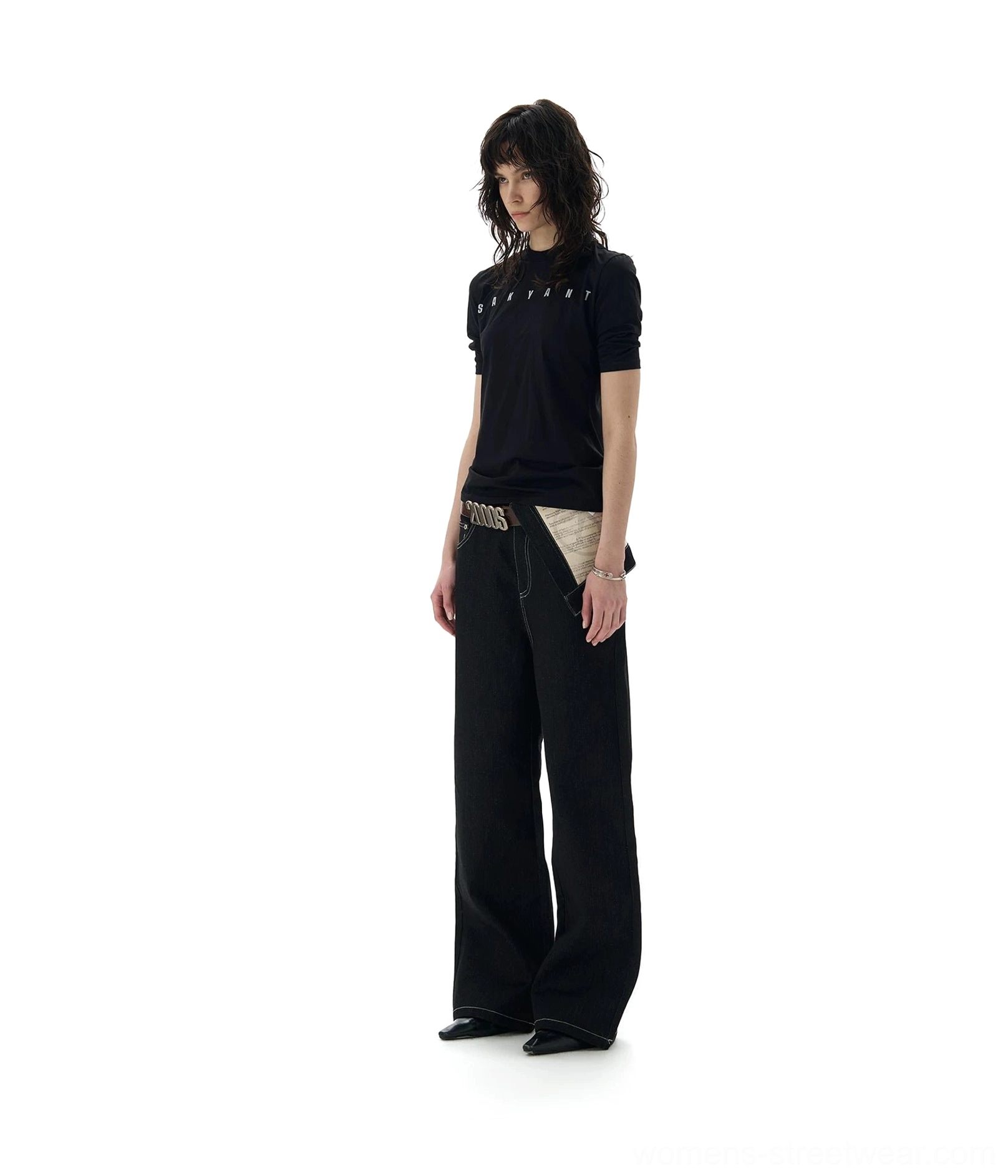Front studio view of black full-length straight-leg jeans with exposed contrast pocketing fabric and clean hem