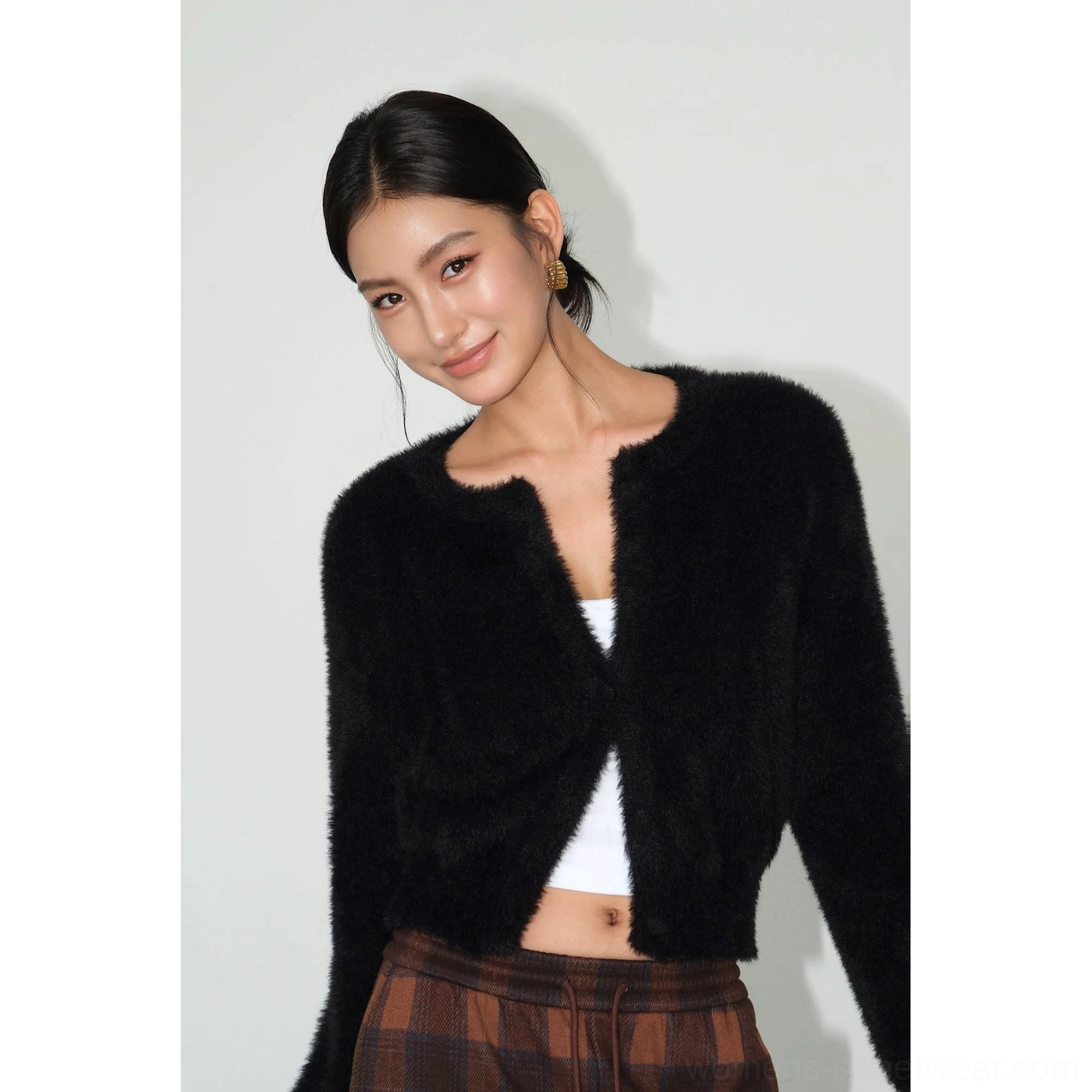 Black fuzzy cropped cardigan with round neckline and button-front knit design for versatile urban streetwear outfits