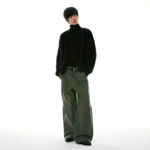 Black fuzzy faux fur knit sweater styled with dark green wide-leg trousers and leather shoes in a minimalist streetwear outfit
