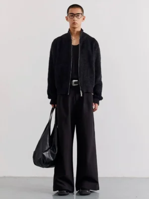 Black fuzzy zip-up fleece cardigan worn in a full-body front view for minimalist Seoul streetwear styling