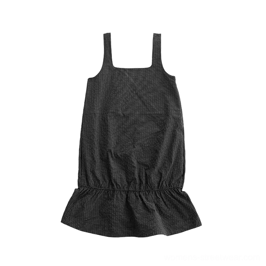 Black gingham ruffled pinafore mini dress flat lay showing square neck wide straps and ruffle hem