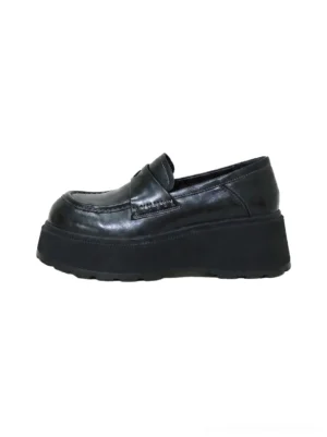 Black glossy rounded-toe chunky platform loafers for women shown in a front close-up with classic slip-on penny-loafer vamp and thick rubber sole