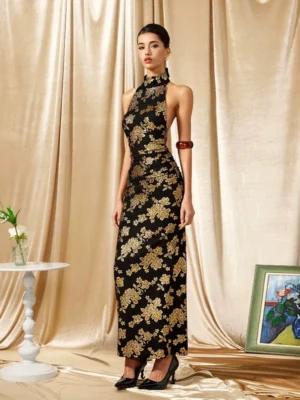 Front full body view of a black and gold floral halter cheongsam maxi dress with high collar fitted silhouette and floor length hem