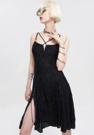 Black gothic crinkle lace harness slip dress front three-quarter view worn with punk accessories and lace-up boots