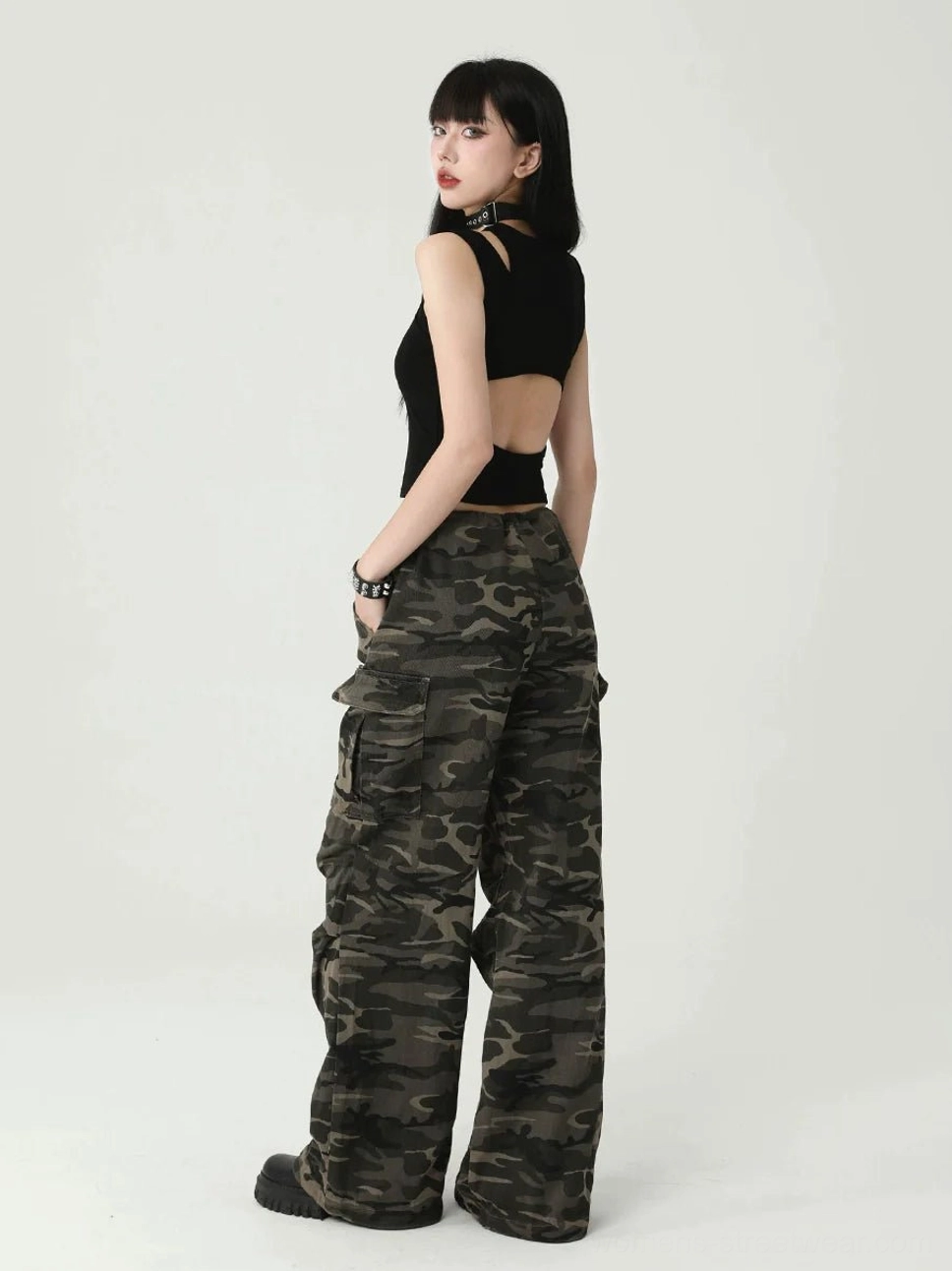 Black gothic cross cropped tank top for women with edgy cutout shoulder details, fitted ribbed texture, and modern punk streetwear style