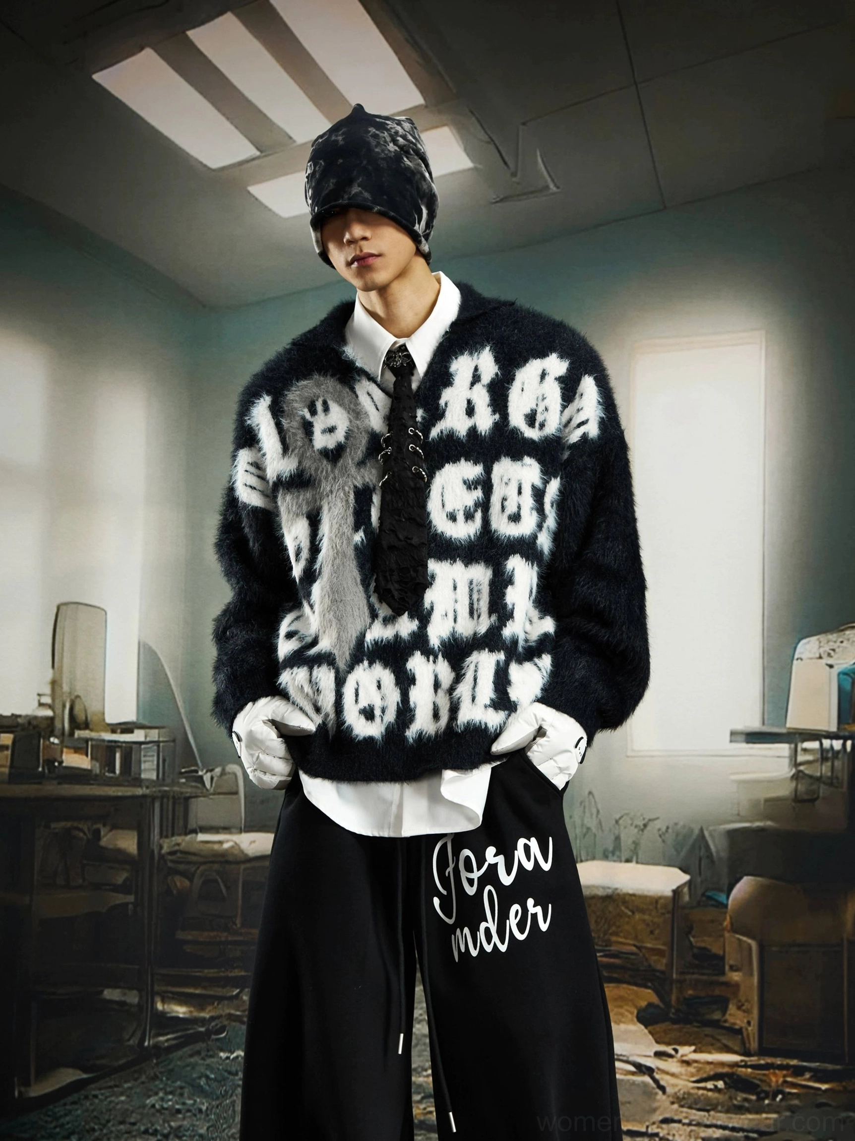 Front three quarter view of a black fuzzy cross sweater with gothic typography, white gloves, and wide leg alternative fashion pants