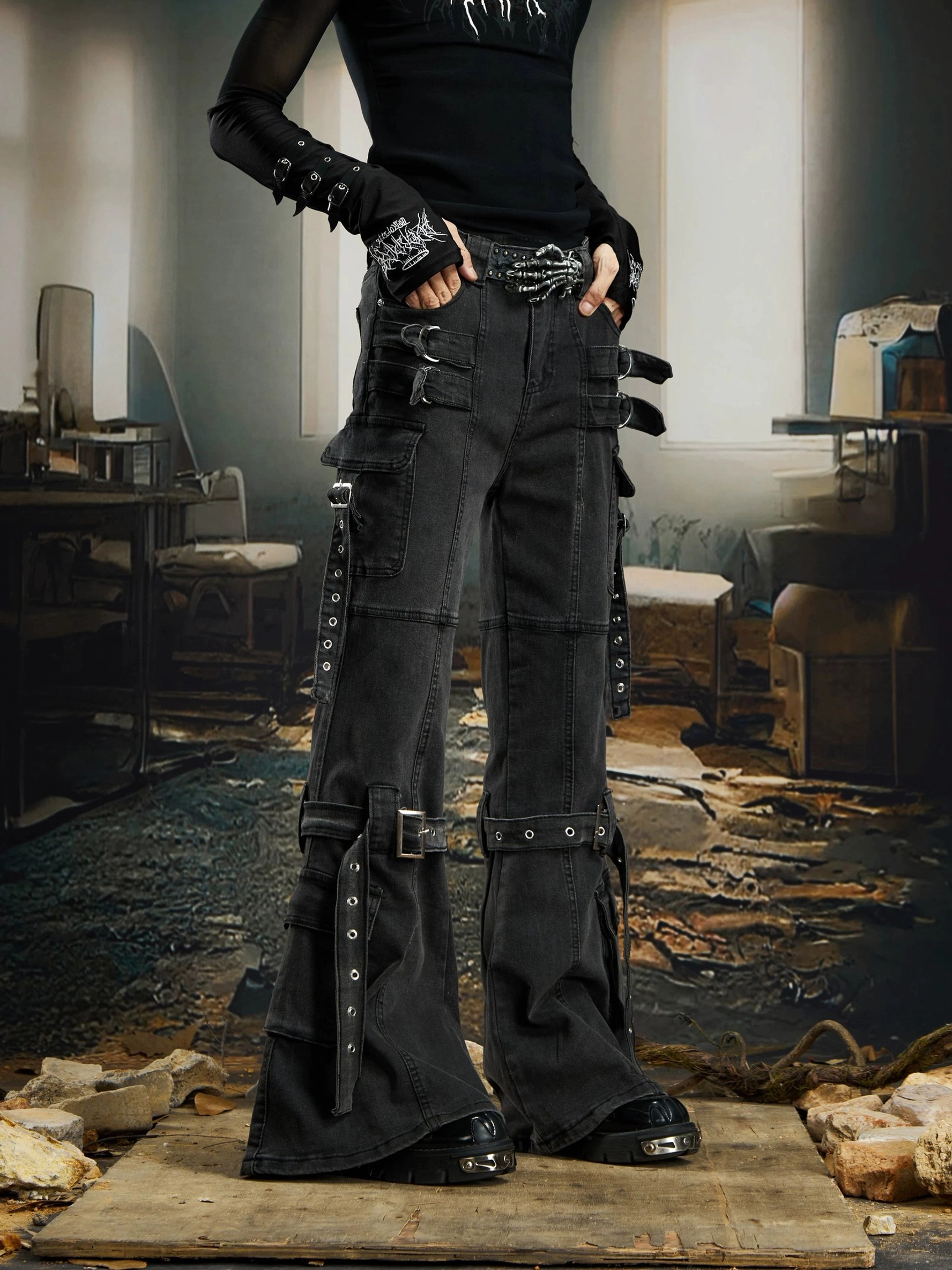 Black gothic harness strap cargo flare jeans with utility pockets, metal buckles, layered straps, washed denim, and cyberpunk streetwear styling