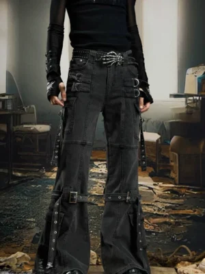 Front view of black gothic harness strap cargo flare jeans with washed denim, utility pockets, metal buckles, rivets, and cyberpunk streetwear details