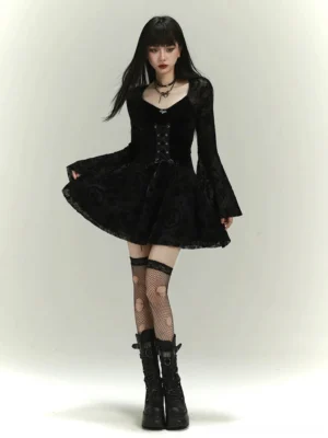 Black gothic lace-up velvet bell sleeve mini dress front view with floral flocked lace sleeves, layered skirt, fishnet tights and platform boots