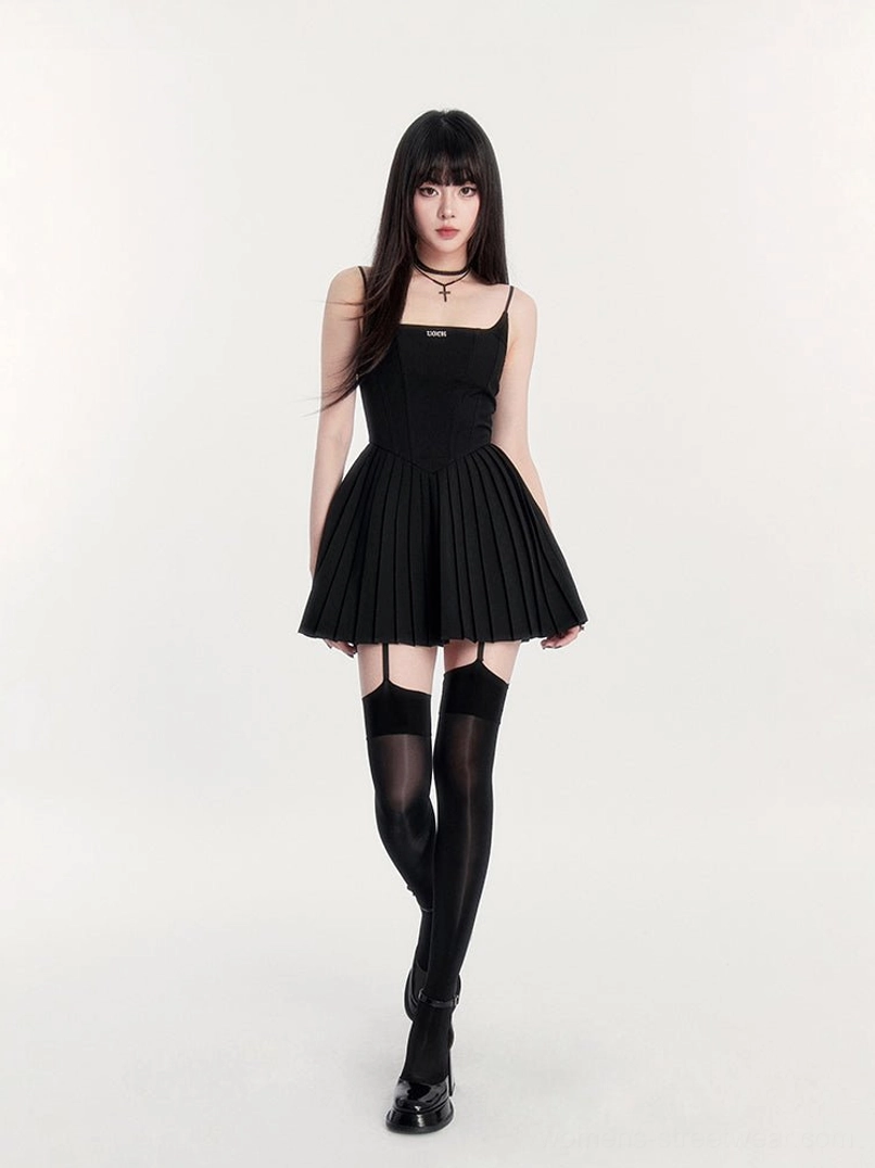 Black gothic pleated mini dress with thin cami straps fitted corset bodice flared skirt and thigh-high stockings