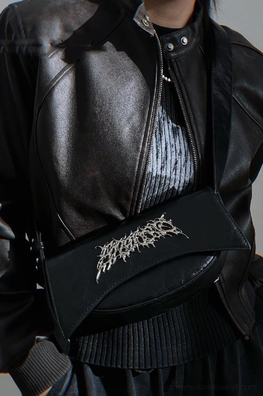 Black PU leather gothic shoulder bag styled as a chest crossbody bag with black leather jacket