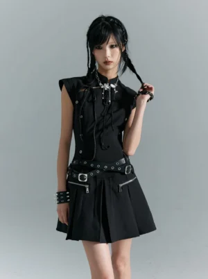 Black gothic punk mini dress front three quarter view showing grommets zippers metal buckles and pleated skirt