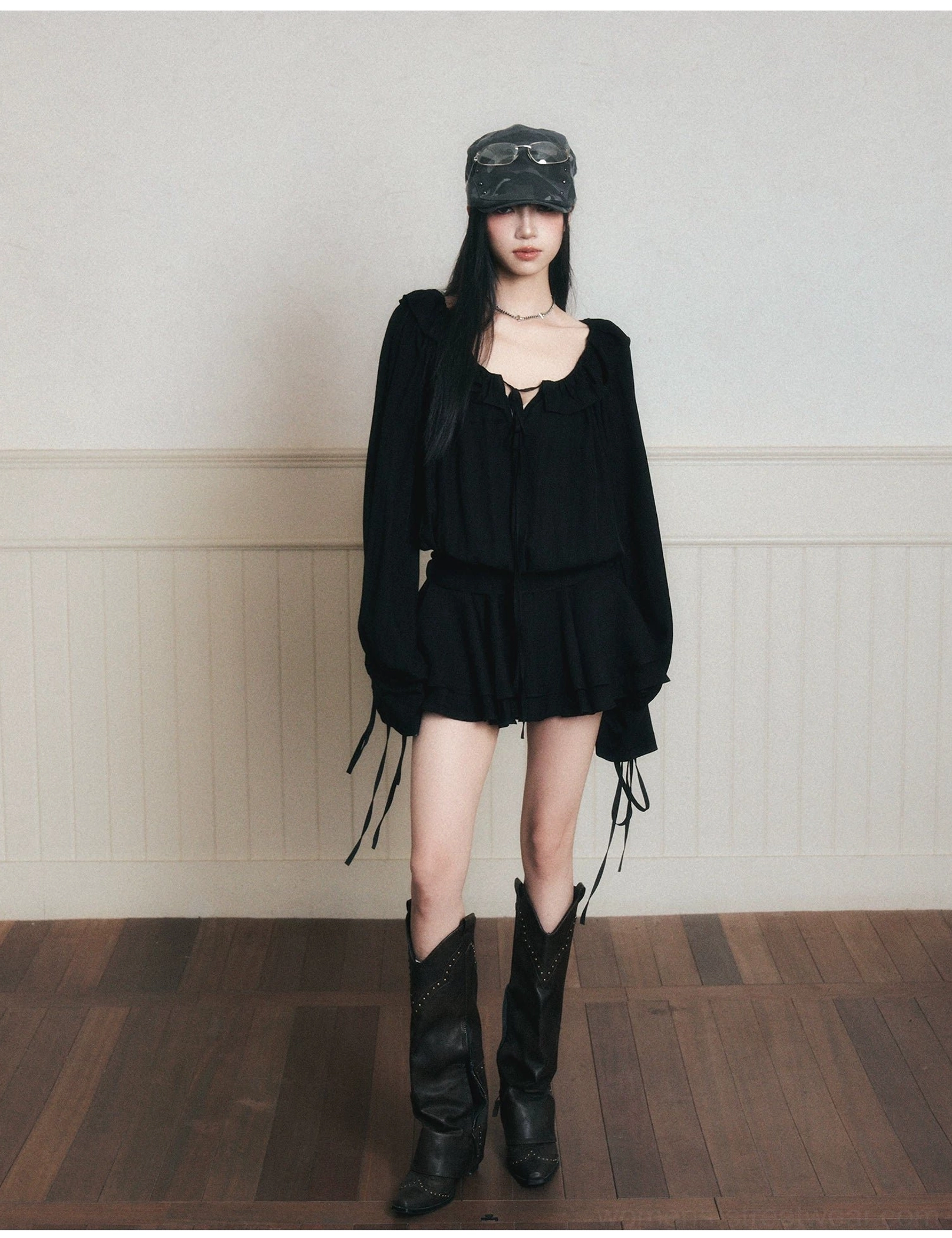 Full-body front view of black gothic ruffle poet mini dress set with long flounce sleeves and layered mini hem