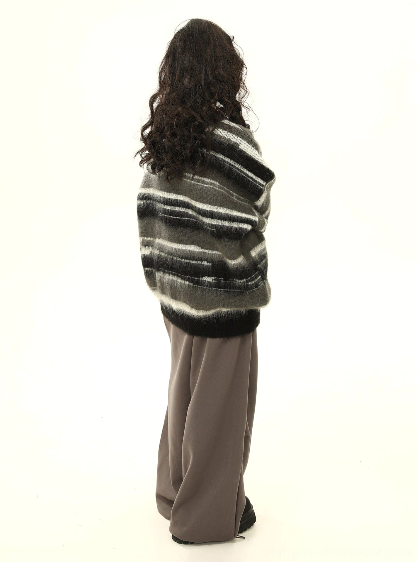 Black gradient stripe fuzzy oversized hooded sweater rear side view in relaxed Seoul streetwear styling