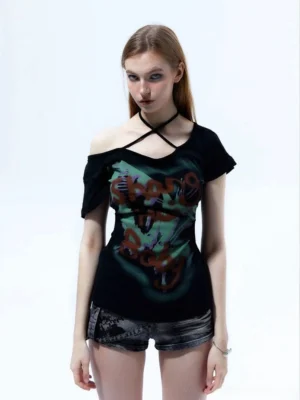 Front view of fitted black graffiti print halter top with crossed choker neckline and off-shoulder sleeves