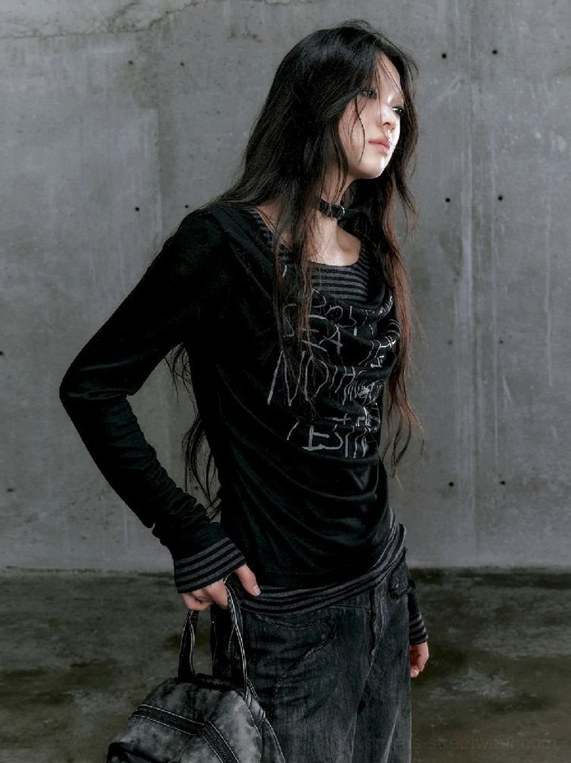 Black graffiti layered long sleeve top in a slim streetwear silhouette side three-quarter view