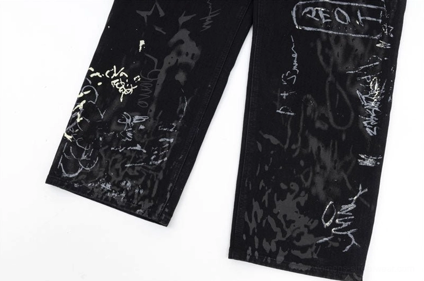 Black graffiti print wide-leg jeans for women with expressive street art graphics and relaxed denim silhouette