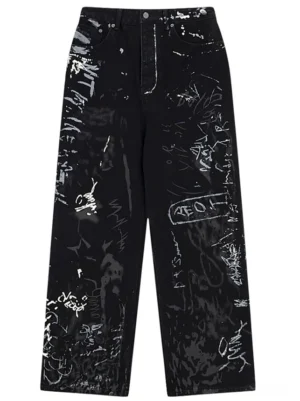 Front flat lay of black graffiti print wide-leg jeans for women with white handwritten street art and paint splatter details