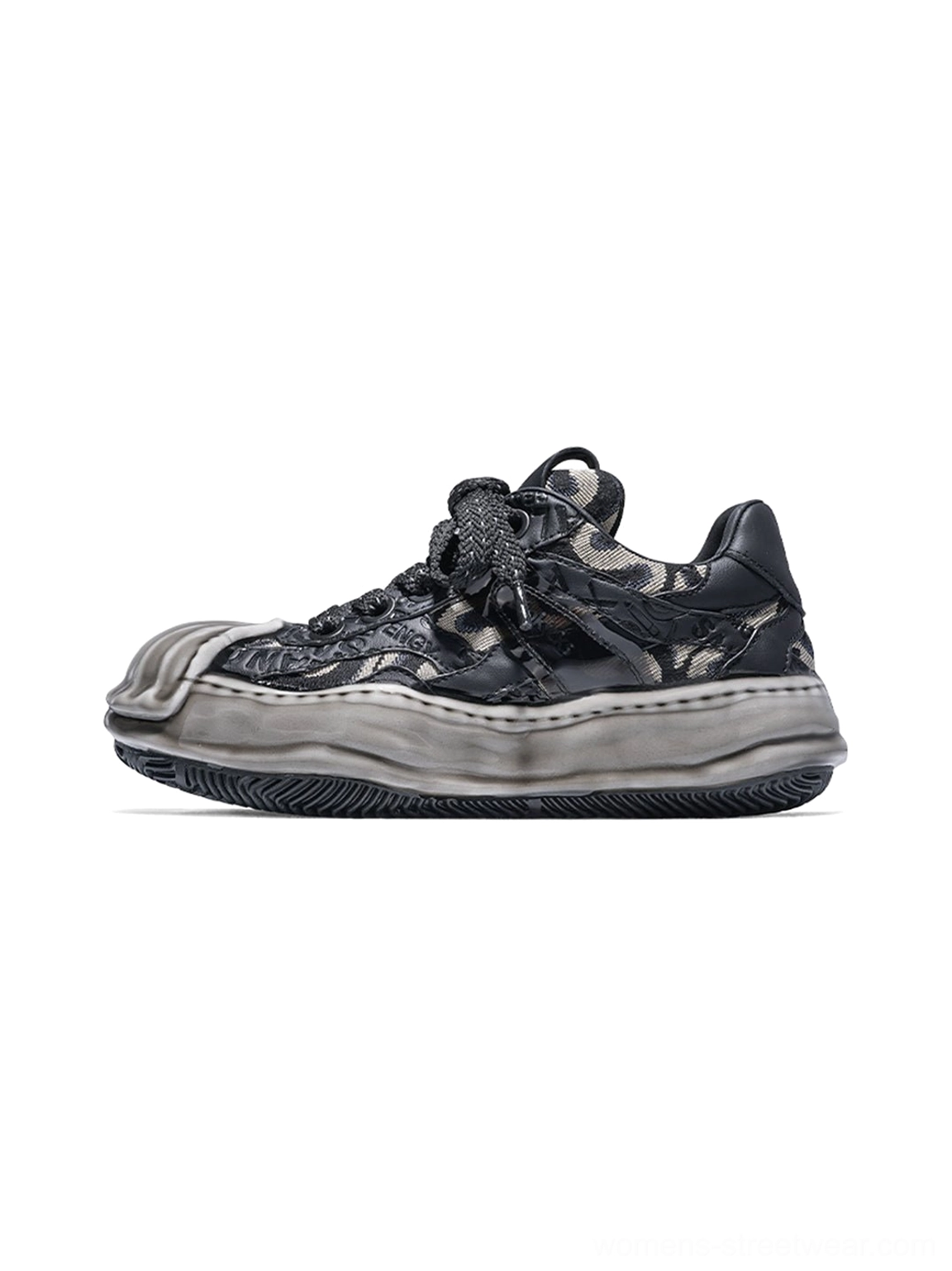 Black and gray distressed camo shell-toe leather skate sneaker with weathered toe cap, layered laces, and matte black sculpted melted outsole