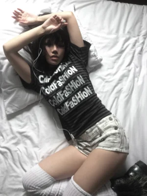 Black gray striped graphic crew neck tee with repeated white front lettering in a relaxed streetwear outfit