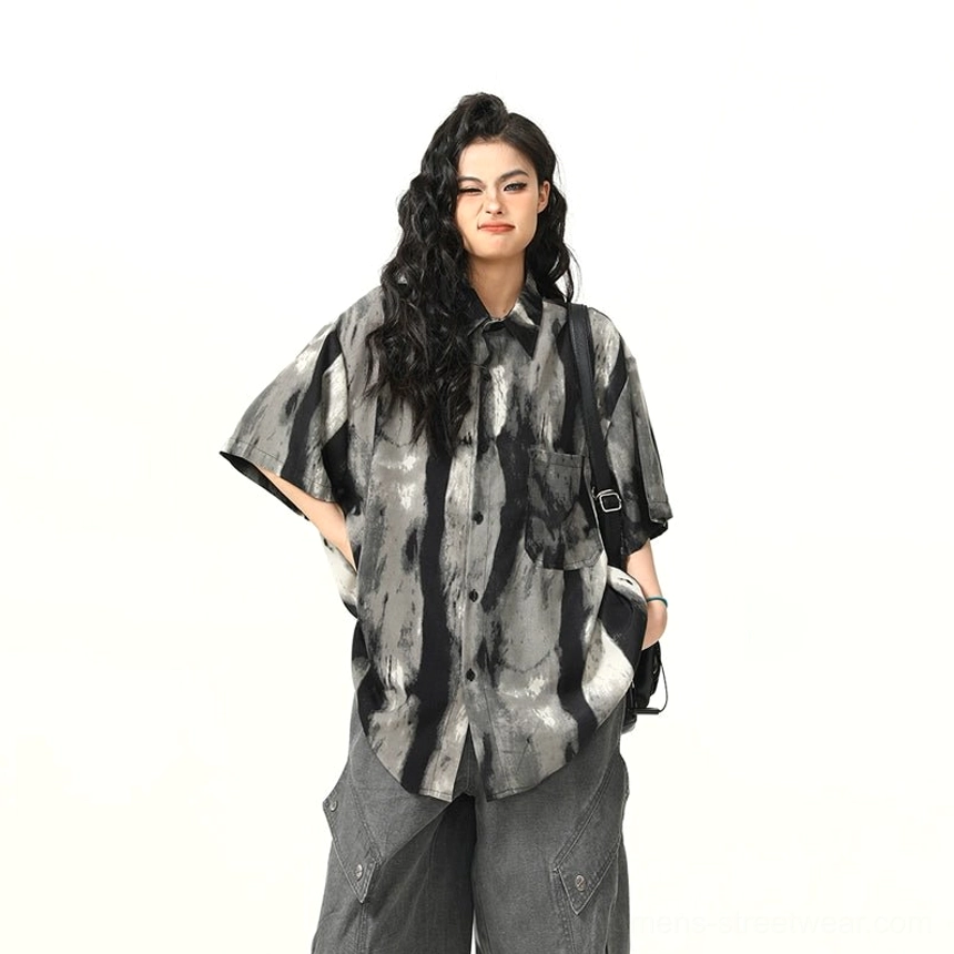 Close front view of oversized black gray tie-dye watercolor shirt with dropped shoulders and vertical abstract print