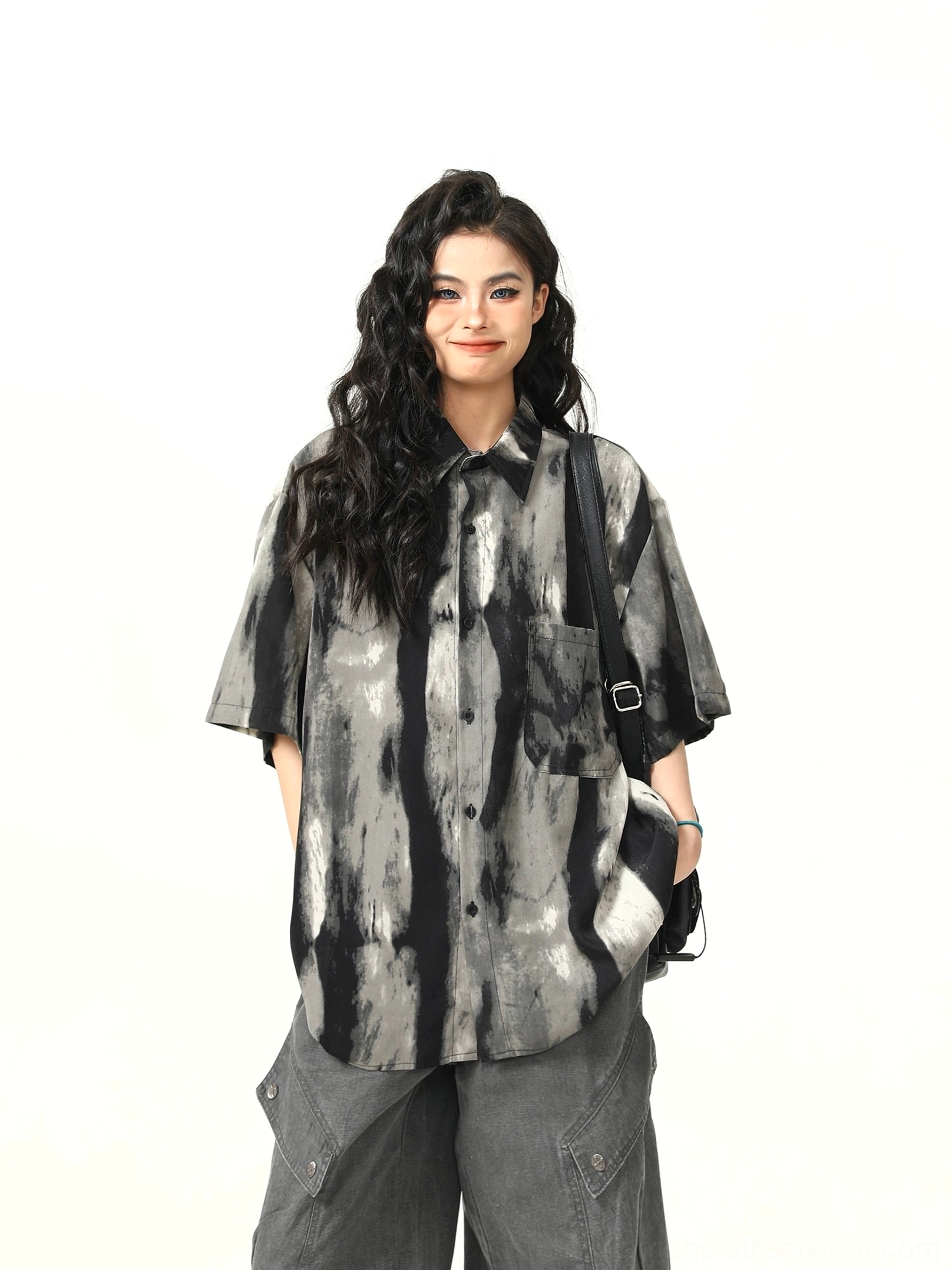 Close front view of black and gray watercolor stripe shirt with neat collar, button closure, and chest pocket