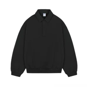 Black heavyweight cotton polo sweater with long sleeves, half button closure, classic collar, and oversized Korean streetwear silhouette