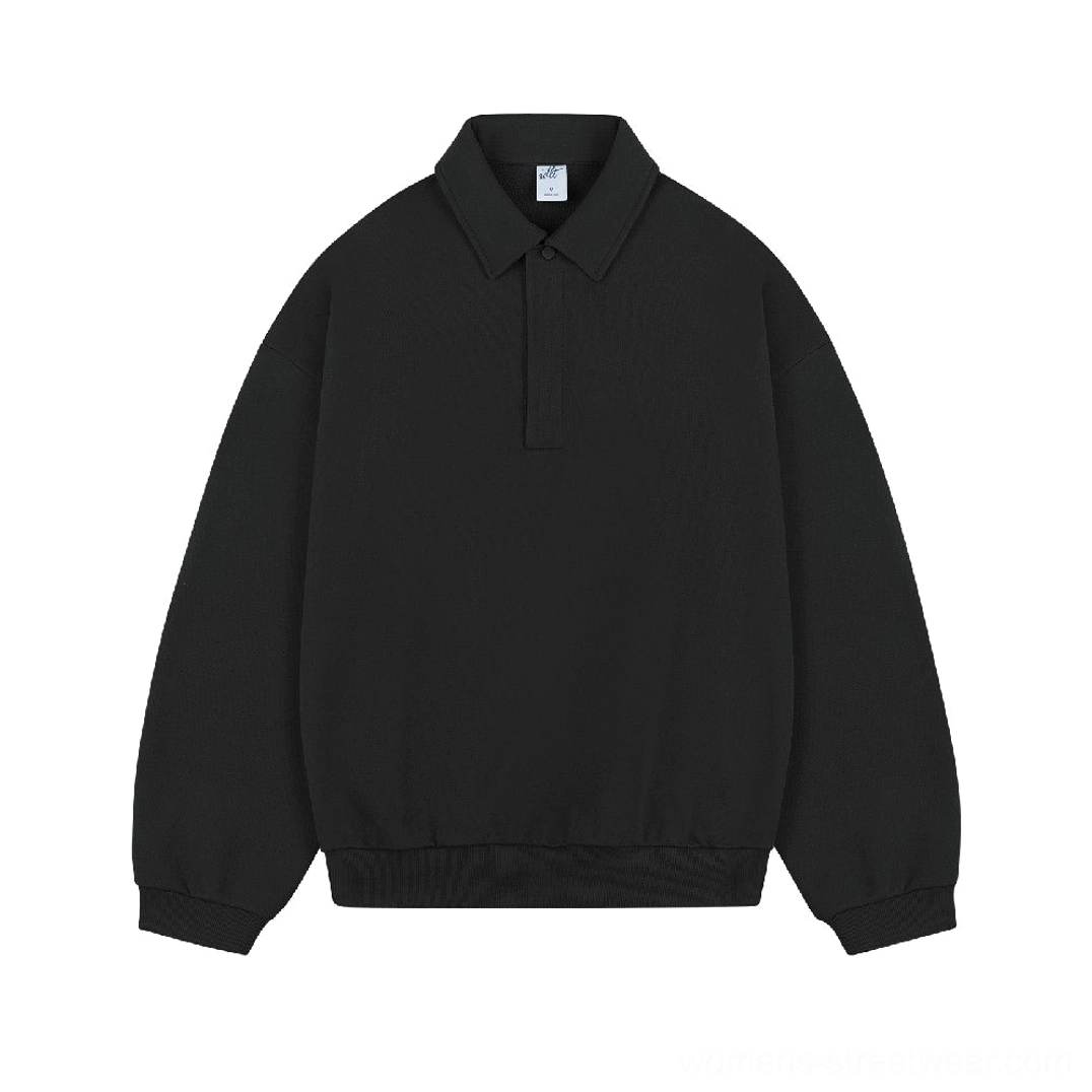Black heavyweight cotton polo sweater with long sleeves, half button closure, classic collar, and oversized Korean streetwear silhouette
