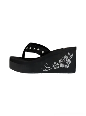 Black hibiscus embroidered platform wedge flip-flops with silver star studded thong straps shown in left flat lay view