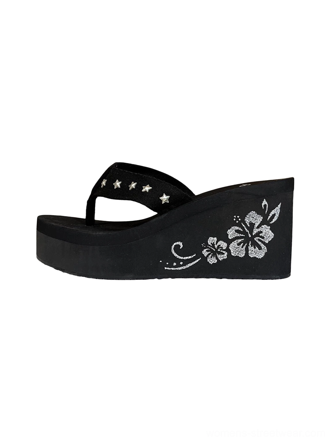 Black hibiscus embroidered platform wedge flip-flops with silver star studded thong straps shown in left flat lay view