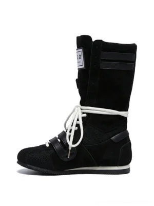Black high-top boxing trainer boots with textured mixed-material upper white flat laces square tongue tag and adjustable ankle strap