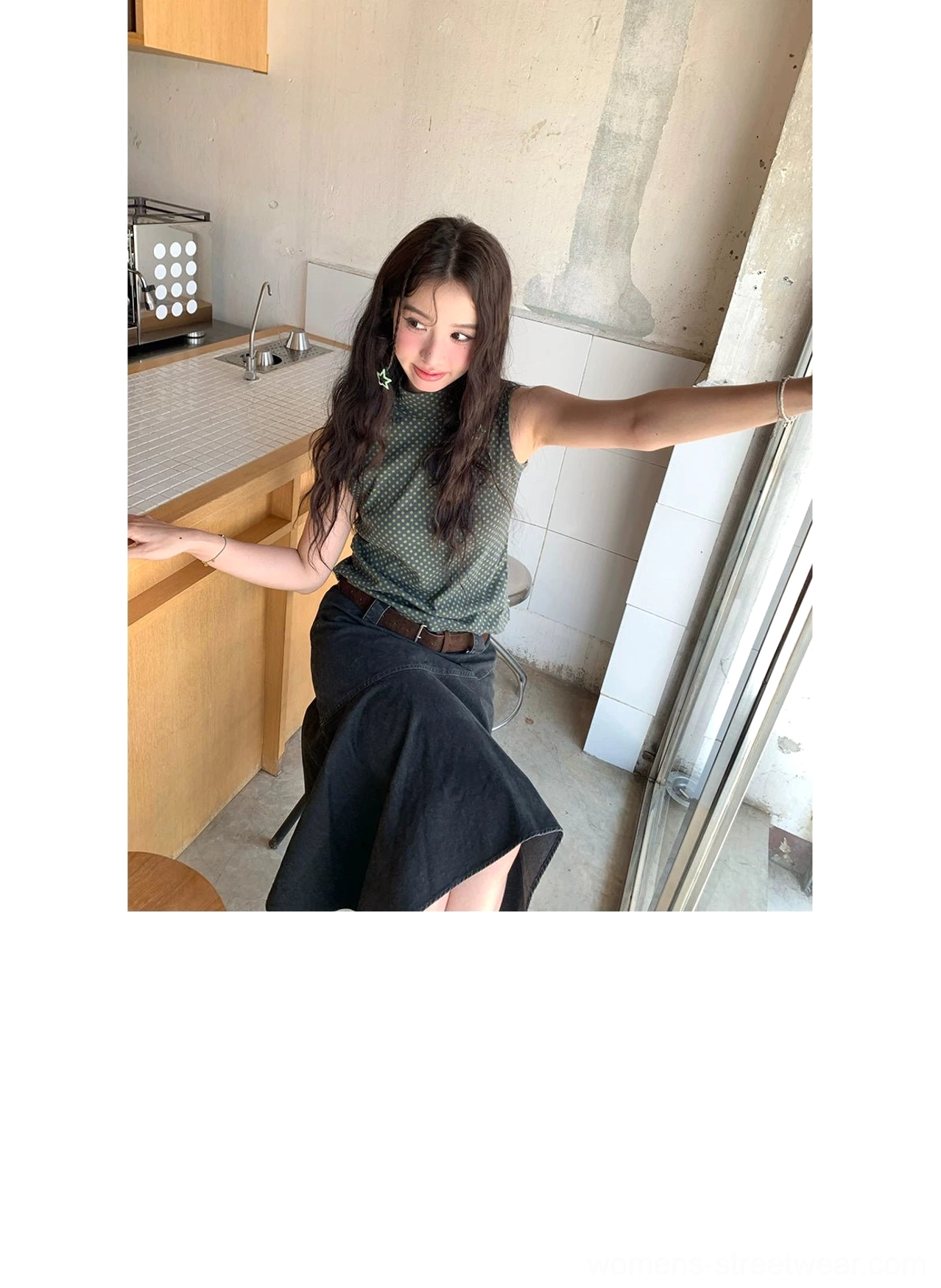 Black high-waist asymmetric panel midi skirt three-quarter view with structured A-line silhouette and washed cotton finish