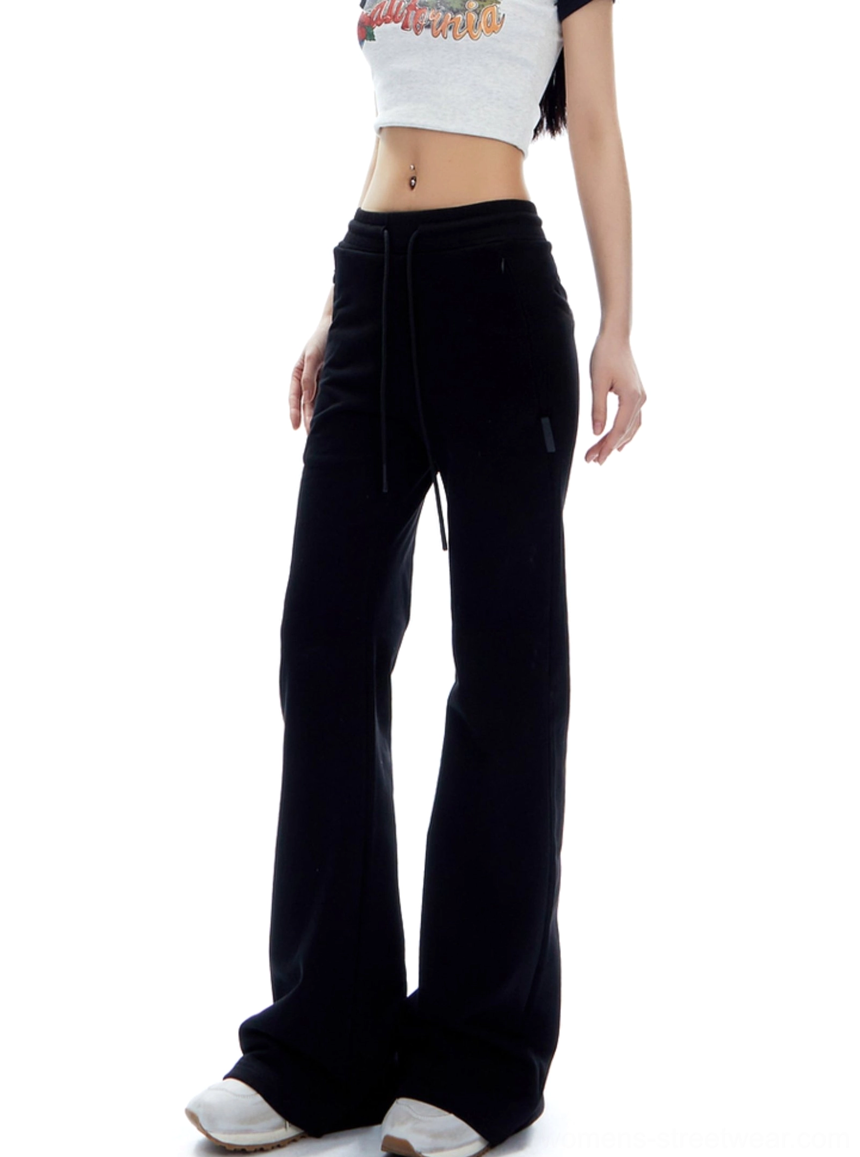 Black high-waist flared sweatpants with drawstring waist and long streetwear silhouette shown in a product image