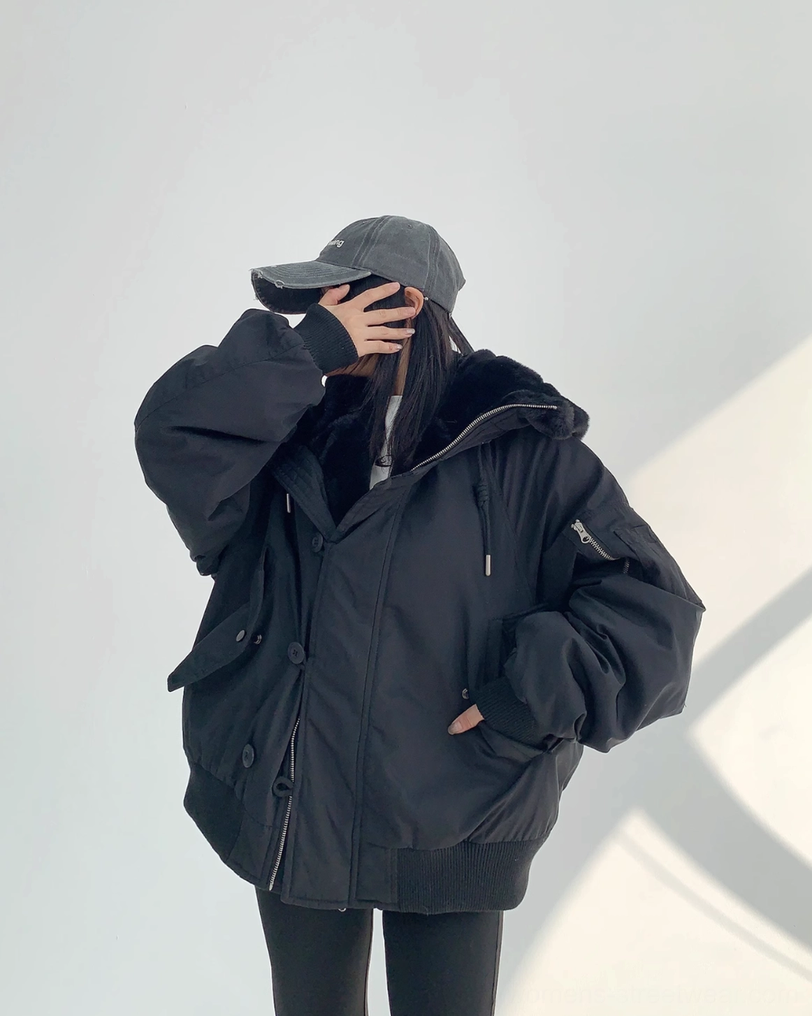 Black hooded sherpa bomber jacket designed for layered Korean street fashion, casual commuting, and cold-weather outfits