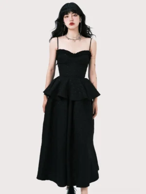 Front full-body view of a black jacquard peplum camisole and high-waisted A-line midi skirt dress set with ruffled sweetheart neckline and spaghetti straps