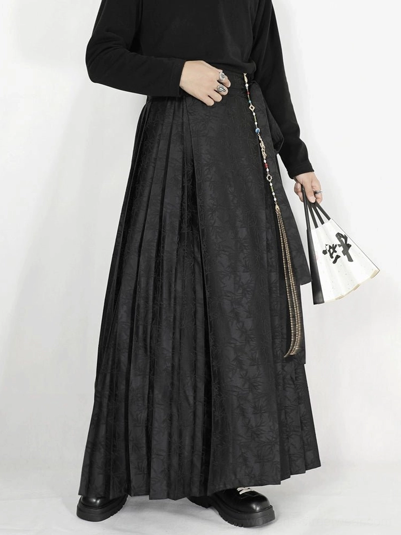 Black floor-length jacquard pleated skirt with wrap-inspired waist and decorative tassel chain streetwear styling
